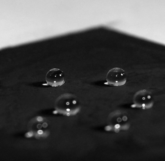 Water droplets deposited on thin ORG-GO film.